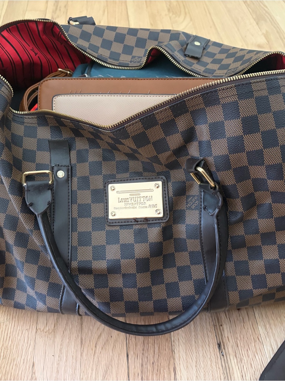 Damier Ebene Travel Bag with Red Interior